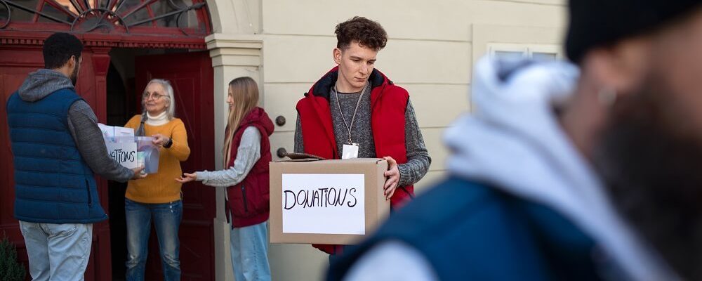 diverse-group-of-volunteers-with-donation-boxes-st-2021-12-14-20-46-57-utc-1